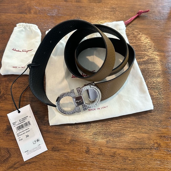 NWT: Ferragamo reversible belt. Black/Tan calf leather w/ unique buckle.MSRP$530